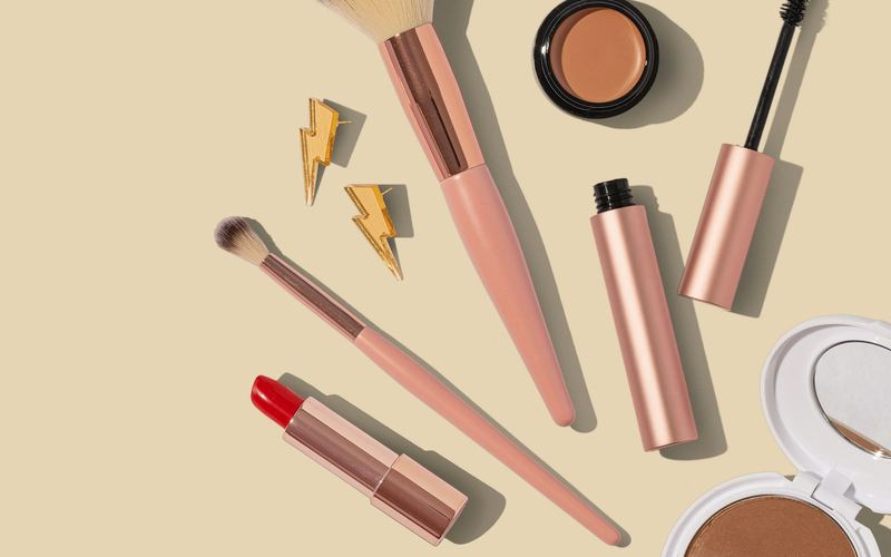 Flat lay of makeup brushes and beauty products