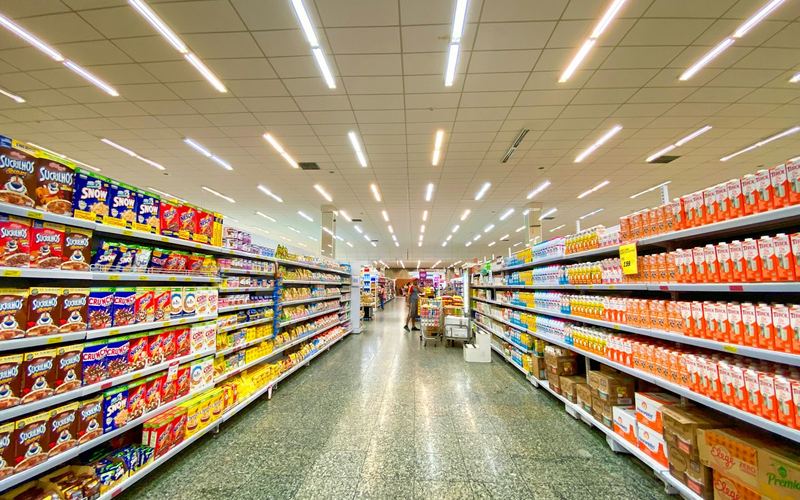 Stocked grocery aisle of consumer packaged goods