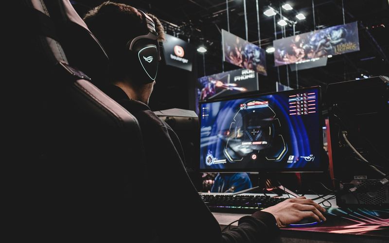 Esports player streaming at a professional gaming setup